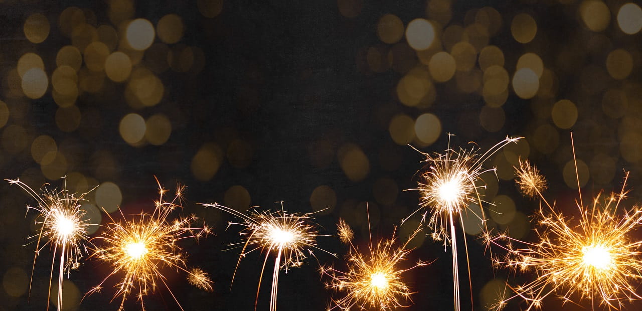 Line of lit sparklers. 